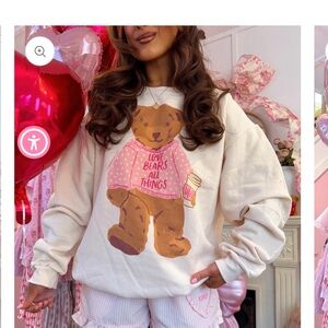 Love bears all things crewneck